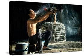 Man Cleaning Thai Gamecock-SantiPhotoSS-Stretched Canvas