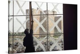 Man Cleaning Windows Near Housing Project-null-Stretched Canvas