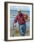 Man Crabbing and Digging for Razor Clams in Sand, Queen Charlotte Islands, Canada-Savanah Stewart-Framed Photographic Print