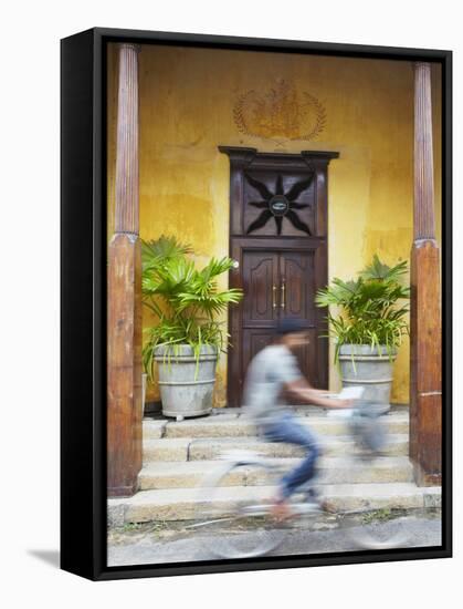 Man Cycling Past Doorway in Old Town of Galle Fort, Galle, Sri Lanka-Ian Trower-Framed Stretched Canvas