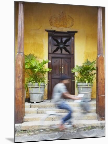 Man Cycling Past Doorway in Old Town of Galle Fort, Galle, Sri Lanka-Ian Trower-Mounted Photographic Print