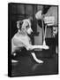 Man Demonstrating Proper Way to Put Splint on Dog in Event of First Aid Being Required-John Phillips-Framed Stretched Canvas