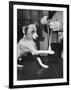 Man Demonstrating Proper Way to Put Splint on Dog in Event of First Aid Being Required-John Phillips-Framed Photographic Print