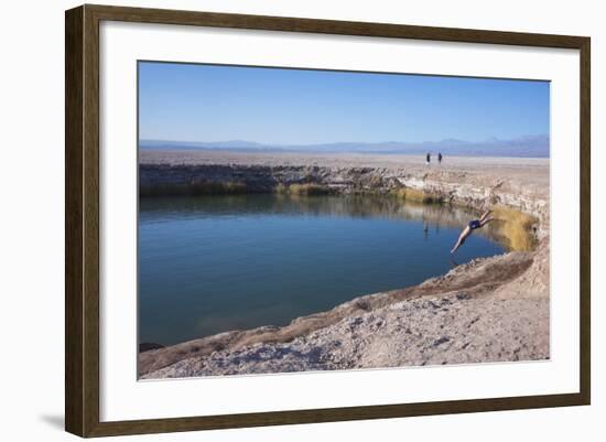 Man Diving into One of the Twin Fresh Lakes (Sala Eyes) in San Pedro De Atacama-Kimberly Walker-Framed Photographic Print