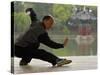 Man Doing Tai Chi Exercises at Black Dragon Pool with One-Cent Pavilion, Lijiang, China-Pete Oxford-Stretched Canvas