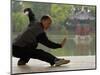 Man Doing Tai Chi Exercises at Black Dragon Pool with One-Cent Pavilion, Lijiang, China-Pete Oxford-Mounted Photographic Print