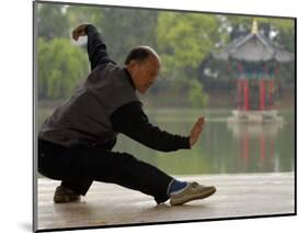 Man Doing Tai Chi Exercises at Black Dragon Pool with One-Cent Pavilion, Lijiang, China-Pete Oxford-Mounted Photographic Print