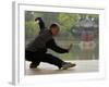 Man Doing Tai Chi Exercises at Black Dragon Pool with One-Cent Pavilion, Lijiang, China-Pete Oxford-Framed Photographic Print