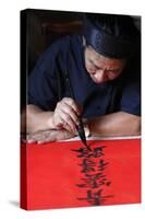 Man doing traditional Chinese writing (calligraphy) in ink using a brush, The Temple of Literature-Godong-Stretched Canvas