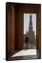Man enjoying the view of Plaza de Espana, framed through an archway, Seville, Andalusia, Spain-Shanna Baker-Framed Stretched Canvas