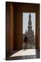 Man enjoying the view of Plaza de Espana, framed through an archway, Seville, Andalusia, Spain-Shanna Baker-Stretched Canvas