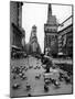 Man Feeding Pigeons in an Empty Times Square During a Taxi Strike-Yale Joel-Mounted Photographic Print