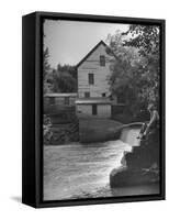 Man Fishing Beside a Waterfall and a 100 Year Old Mill-Bob Landry-Framed Stretched Canvas