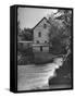 Man Fishing Beside a Waterfall and a 100 Year Old Mill-Bob Landry-Framed Stretched Canvas