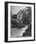 Man Fishing Beside a Waterfall and a 100 Year Old Mill-Bob Landry-Framed Photographic Print