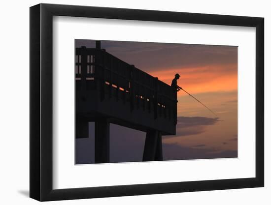 Man fishing from the Tybee Pier at sunrise, Tybee Island, Georgia, USA-Joanne Wells-Framed Photographic Print