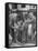 Man Fixing Basket on Bicycle as Children Watch Attentively-Nina Leen-Framed Stretched Canvas