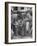 Man Fixing Basket on Bicycle as Children Watch Attentively-Nina Leen-Framed Photographic Print