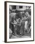 Man Fixing Basket on Bicycle as Children Watch Attentively-Nina Leen-Framed Photographic Print