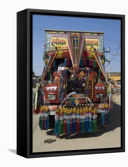 Man Fixing Decoration onto Truck for Diwali Celebrations, Pali District, Rajasthan, India, Asia-Annie Owen-Framed Stretched Canvas