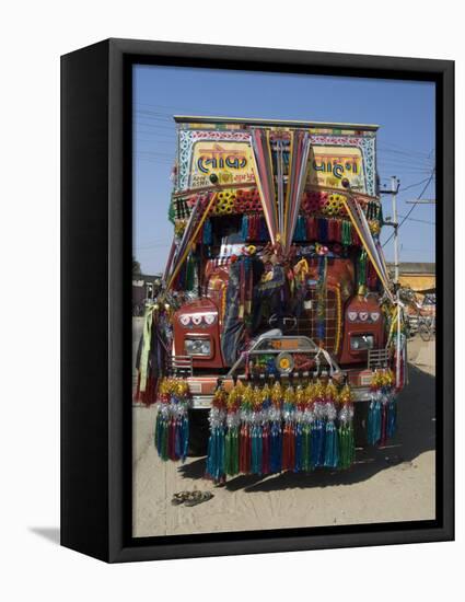 Man Fixing Decoration onto Truck for Diwali Celebrations, Pali District, Rajasthan, India, Asia-Annie Owen-Framed Stretched Canvas