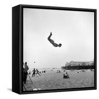 Man Flying Off a Trampoline at Santa Monica Beach-Loomis Dean-Framed Stretched Canvas