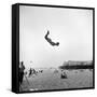 Man Flying Off a Trampoline at Santa Monica Beach-Loomis Dean-Framed Stretched Canvas