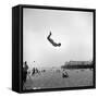 Man Flying Off a Trampoline at Santa Monica Beach-Loomis Dean-Framed Stretched Canvas