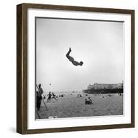 Man Flying Off a Trampoline at Santa Monica Beach-Loomis Dean-Framed Photographic Print