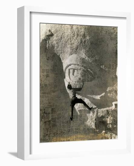 Man Hangs Onto Eye at Mount Rushmore-null-Framed Photographic Print