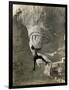 Man Hangs Onto Eye at Mount Rushmore-null-Framed Photographic Print