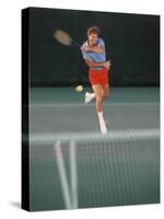 Man Hitting Tennis Ball-Bill Bachmann-Stretched Canvas