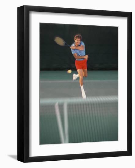 Man Hitting Tennis Ball-Bill Bachmann-Framed Photographic Print