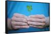 Man Holding Four-Leaf Clover-Joe Petersburger-Framed Stretched Canvas