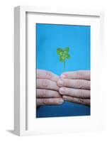 Man Holding Four-Leaf Clover-Joe Petersburger-Framed Photographic Print