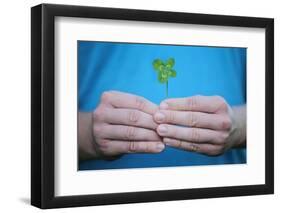 Man Holding Four-Leaf Clover-Joe Petersburger-Framed Photographic Print