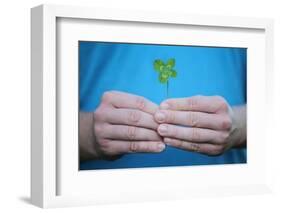 Man Holding Four-Leaf Clover-Joe Petersburger-Framed Photographic Print