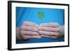 Man Holding Four-Leaf Clover-Joe Petersburger-Framed Photographic Print