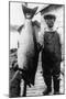 Man Holding Life Size King Salmon - Alaska-Lantern Press-Mounted Art Print