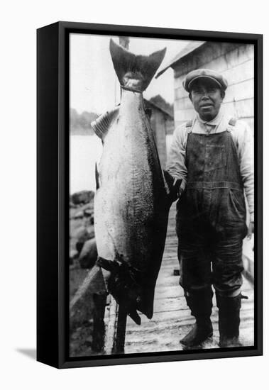 Man Holding Life Size King Salmon - Alaska-Lantern Press-Framed Stretched Canvas