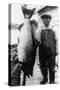 Man Holding Life Size King Salmon - Alaska-Lantern Press-Stretched Canvas