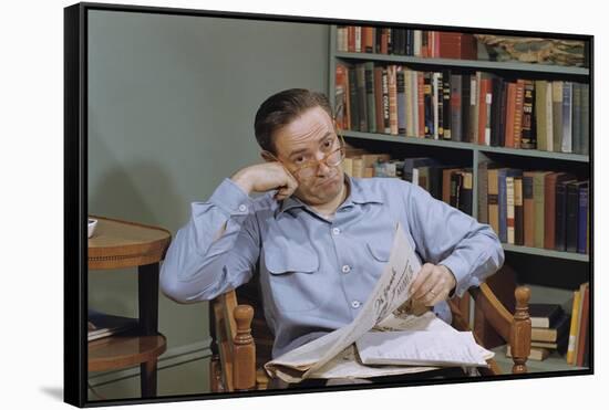 Man Holding Newspaper While Thinking-William P. Gottlieb-Framed Stretched Canvas