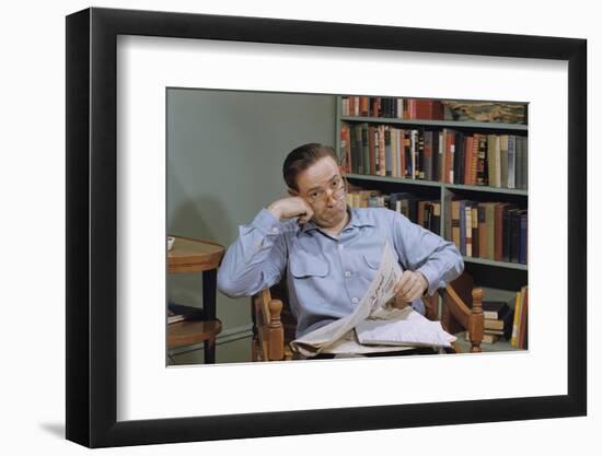 Man Holding Newspaper While Thinking-William P. Gottlieb-Framed Photographic Print