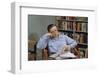 Man Holding Newspaper While Thinking-William P. Gottlieb-Framed Photographic Print