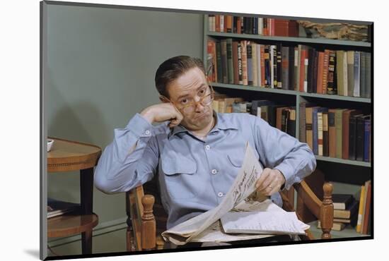 Man Holding Newspaper While Thinking-William P. Gottlieb-Mounted Photographic Print