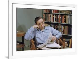 Man Holding Newspaper While Thinking-William P. Gottlieb-Framed Photographic Print