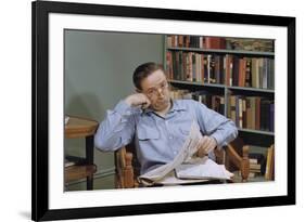 Man Holding Newspaper While Thinking-William P. Gottlieb-Framed Photographic Print