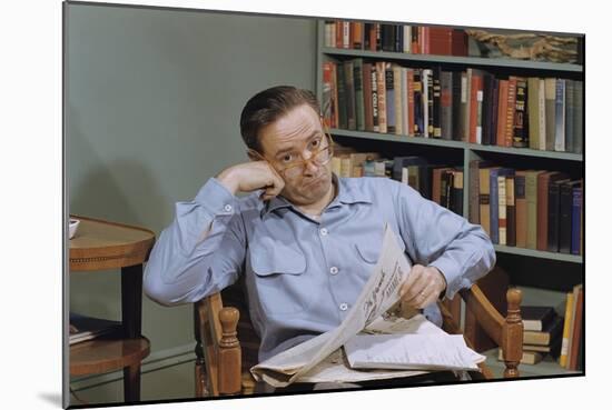 Man Holding Newspaper While Thinking-William P. Gottlieb-Mounted Photographic Print