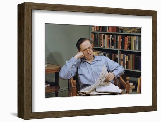 Man Holding Newspaper While Thinking-William P. Gottlieb-Framed Photographic Print