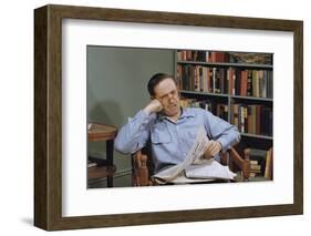 Man Holding Newspaper While Thinking-William P. Gottlieb-Framed Photographic Print